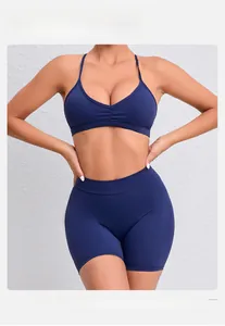 Close-up of deep blue yoga set featuring V-neck sports bra with detachable thin straps