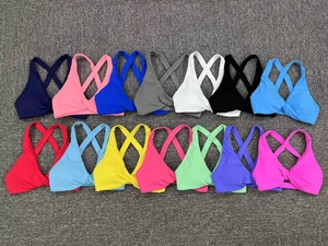Collection of sports bras with front twist knot and criss-cross straps in 15 colors