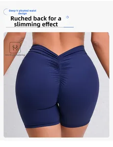 Detail of high-waist scrunch butt design and deep V-waistband on navy blue yoga shorts