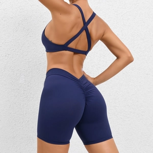 Deep blue yoga set with cross back sports bra and high waisted scrunch butt shorts