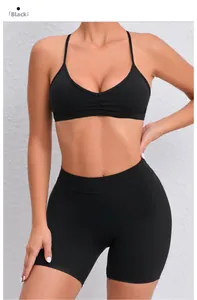 Detail of black two-piece yoga set with V-neck sports bra and high-waisted gym shorts
