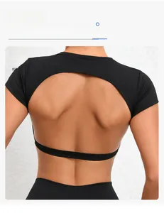 Detail of black quick-dry yoga top featuring a stylish oval back cutout for fitness