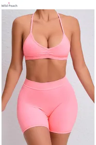 Detail of Wild Peach two-piece yoga set featuring ruched sports bra and high waist shorts