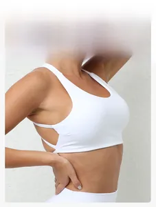 Close-up of white sports bra side detail with breathable cut-out drawstring design