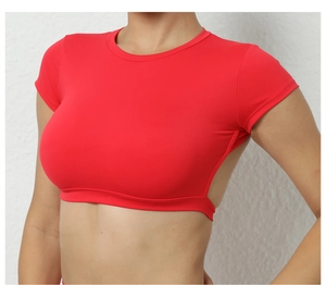 Close-up of a vibrant red open-back yoga top with breathable fabric and wide band