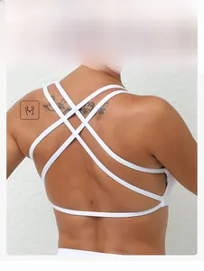 Detail of white sports bra with criss-cross back straps and breathable fabric texture