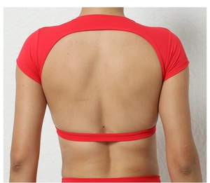 Close-up of red compression yoga top featuring a large circular open back cutout design