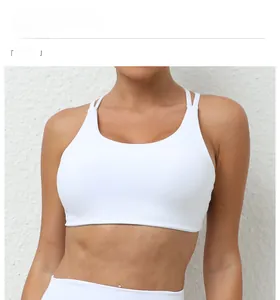 Detailed view of white sports bra with double thin straps and breathable fabric