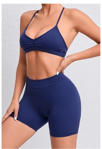 Detailed close-up of seamless navy blue yoga set showing matte texture and elastic fit