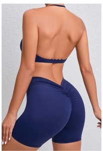Close-up of high-waist yoga shorts with V-shaped waistband and scrunch butt detail