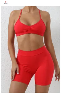 Detail of red quick-dry yoga set showing halter straps and high-waist shorts