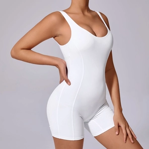 Close-up of white one-piece yoga romper showing high-elasticity fabric and shaping seams