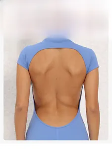 Detail of the open back circular cutout design on this blue yoga bodysuit for women