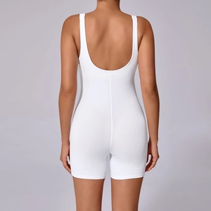 Back view of white seamless one-piece yoga romper featuring a deep U-back design and soft fabric