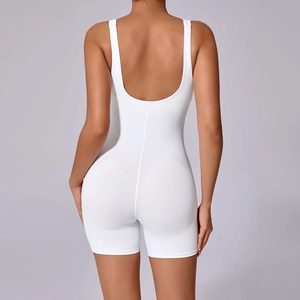 Detail of the high-stretch white backless bodysuit showing the deep U-shape design