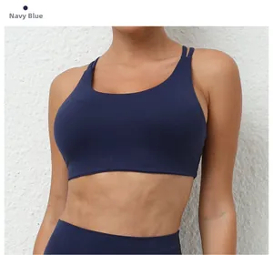 Close-up of navy blue sports bra showing high-elasticity quick-dry fabric and U-neck detail
