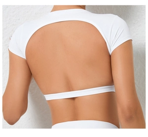 Close-up of white yoga top featuring a stylish back cutout and high-elasticity fabric