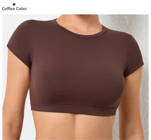 Close-up detail of coffee brown crop top fitness shirt showing elastic seam and fabric texture