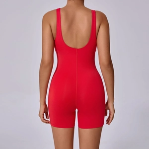 Detail view of the U-shaped open back and stitching on this red tight yoga bodysuit