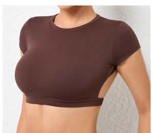 Detail of coffee brown crop top showing smooth elastic fabric and flat seams for yoga