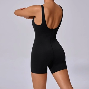 Detailed back view of high-stretch black one-piece yoga romper with deep scoop back cut