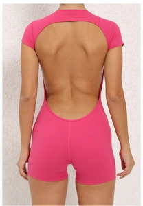 Close-up of open back design on rose pink fitness bodysuit showing U-shaped cut and seams