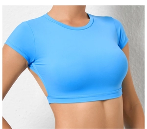 Close-up of sky blue moisture-wicking cropped yoga top with breathable hollow back design