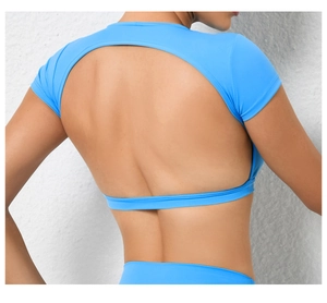 Detail of blue backless yoga t-shirt featuring a large oval cutout and premium fabric