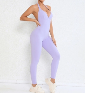 Detailed back view of a lavender halter backless yoga jumpsuit with ruched peach lift design