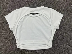 Flat lay of a white short sleeve quick-dry sports top featuring a cutout open back design