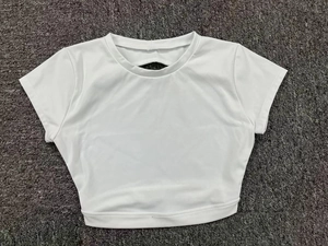 Detailed view of white short-sleeve crop top yoga shirt with cut-out back design