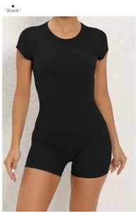 Close-up of black backless yoga bodysuit with built-in chest pads and slim fit design