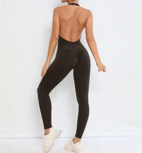 Close-up of halter back yoga jumpsuit with V-cut open back and scrunched booty pockets