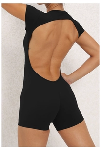 Detail view of the open-back design on this black athletic yoga bodysuit for women