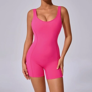 Detail shot of hot pink one-piece yoga jumpsuit with U-neck design and shaping seams
