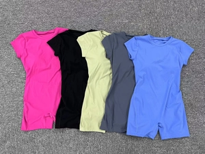 Short sleeve yoga jumpsuits in five colors displayed on a textured grey surface