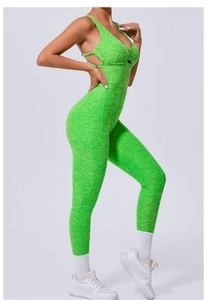 Detail of green textured yoga bodysuit with cross back straps and side cutouts