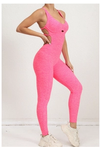 Side view of pink yoga bodysuit featuring criss-cross straps and cutout details