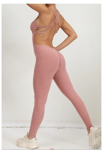 Detail of cross-back adjustable straps on a mauve seamless yoga bodysuit for women