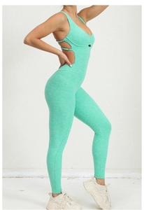 Detail of mint green crossover straps and textured marl fabric on yoga jumpsuit