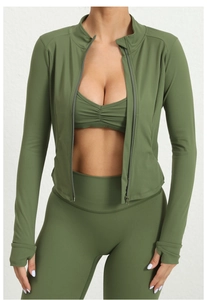 Detailed view of olive green three-piece activewear set with zip-up jacket and leggings