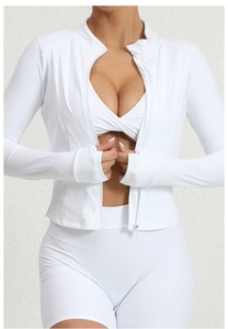 Close-up of a white quick-dry zipper jacket and ribbed athletic top on a fitness model
