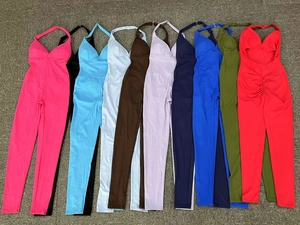 Detailed flat lay of backless halter yoga jumpsuits showing nine vibrant colors and textures