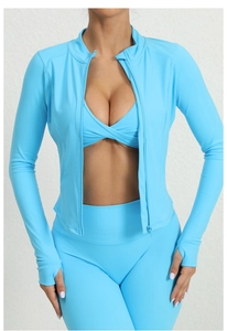 Detail of light blue sports jacket with stand collar and thumbhole design for running