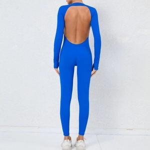 Detail of royal blue backless yoga jumpsuit with U-shaped cutout and long sleeves