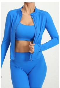 Detail of blue tight-fitting long sleeve sports jacket and high waist yoga leggings set