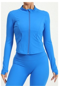 Detail view of bright blue running jacket featuring thumbholes and stand collar