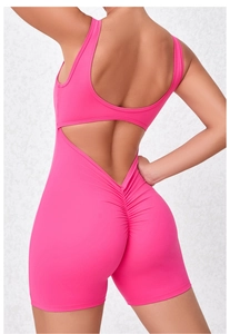 Detail showing the deep V-back cut and scrunch butt seam on pink yoga bodysuit