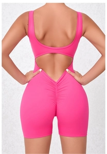Detail of rose red backless yoga bodysuit with ruched seam for butt lifting effect