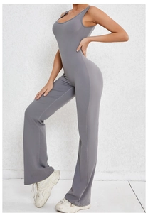 Detail of grey backless yoga jumpsuit with flared legs and sleeveless high-stretch fabric